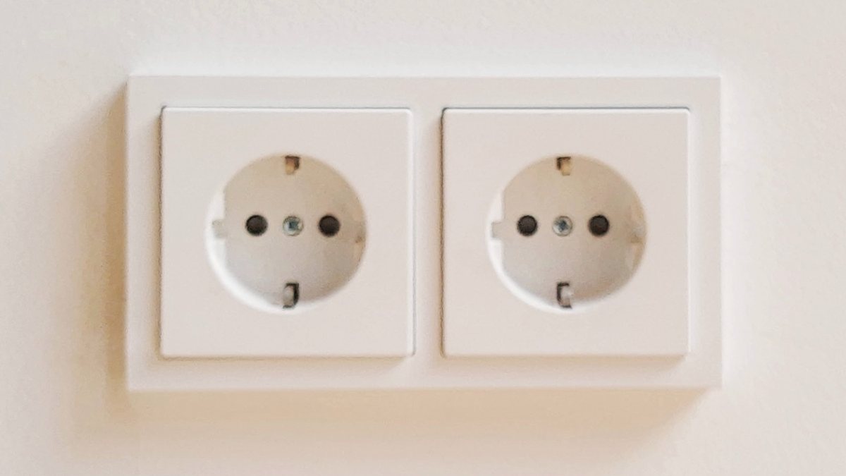 A white double wall socket with two round holes